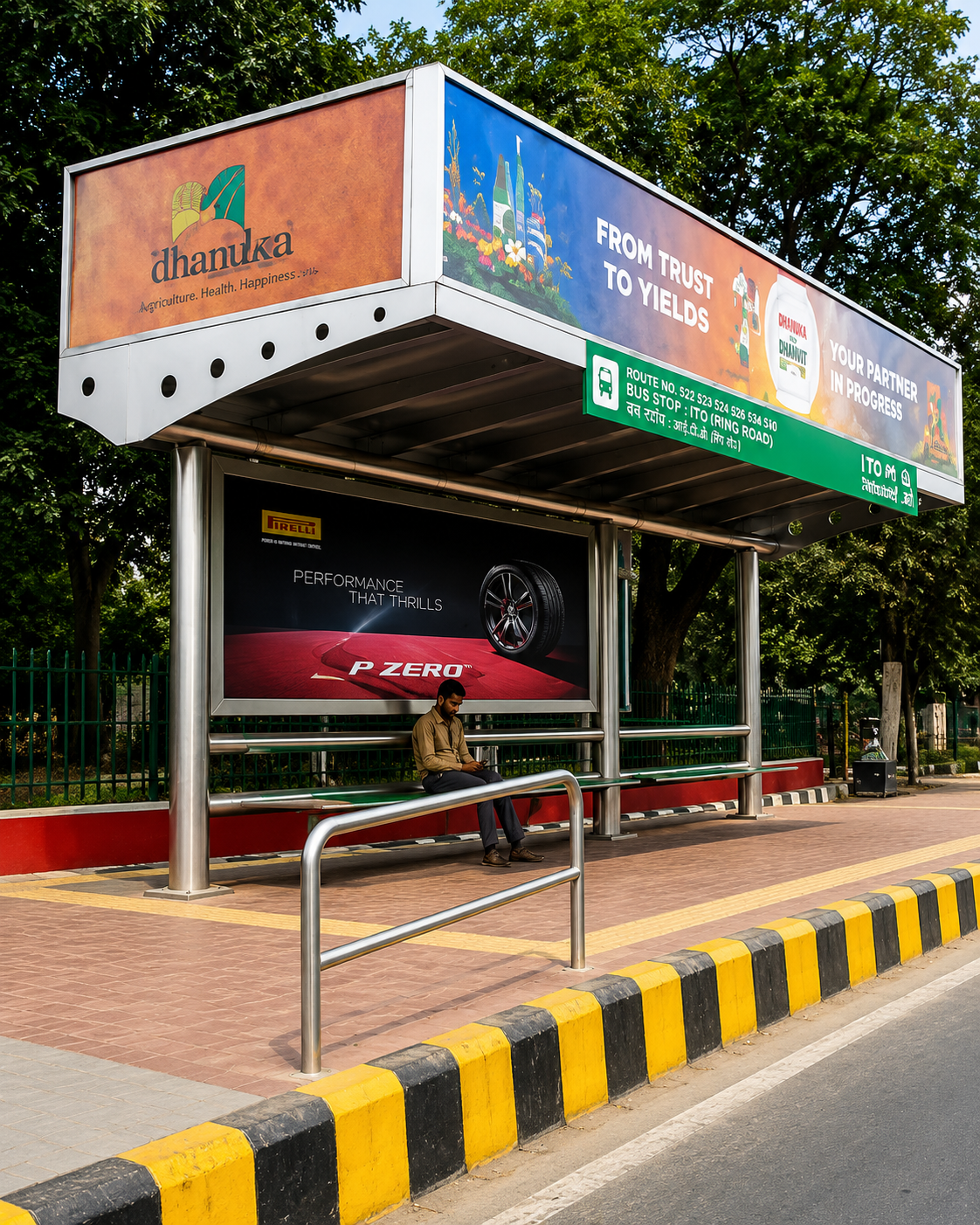 steel-framed bus shelter with integrated advertising display panels.